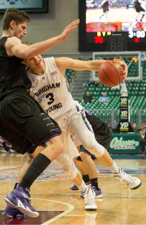 Rick Egan  |  The Salt Lake Tribune

Brigham Young Cougars guard Tyler Haws (3) tries to get past  Portland Pilots center Riley Barker (14), in West Coast Conference Basketball Championship action, BYU vs. Portland, at the Orleans Arena, in Las Vegas, Monday, March 9, 2015