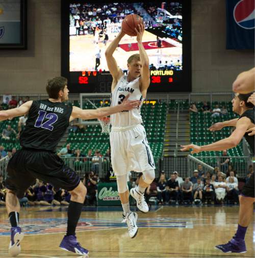 Rick Egan  |  The Salt Lake Tribune

Brigham Young Cougars guard Tyler Haws grabs a pass as Portland Pilots center Thomas van der Mars (12) defends in West Coast Conference Basketball Championship action, BYU vs. Portland, at the Orleans Arena in Las Vegas, Monday, March 9, 2015.