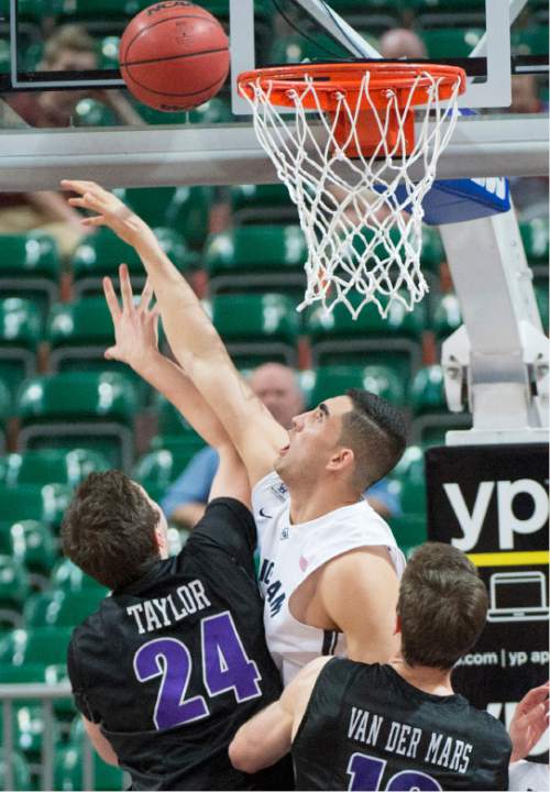 Rick Egan  |  The Salt Lake Tribune

Brigham Young Cougars center Corbin Kaufusi (44) blocks a shot by Portland Pilots forward Gabe Taylor (24) in West Coast Conference Basketball Championship action, BYU vs. Portland, at the Orleans Arena in Las Vegas, Monday, March 9, 2015.