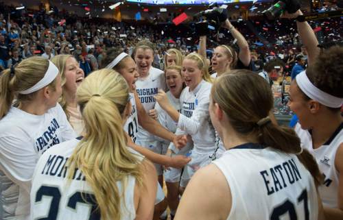 Rick Egan  |  The Salt Lake Tribune

Brigham Young Cougars celebrate after defeating the San Francisco Dons 76-65, in the West Coast Conference Women's Basketball Championship game, at the Orleans Arena, in Las Vegas, Tuesday, March 10, 2015