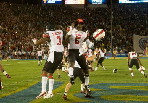 Rick Egan  |  The Salt Lake Tribune

Utah Utes defensive back Charles Henderson (3) and  Utes defensive back Chandler Johnson (5) celebrate the Utes a 30-28 upset over UCLA in Pac 12 action Utah vs UCLA, at the Rose Bowl in Pasadena, Saturday, October 4, 2014