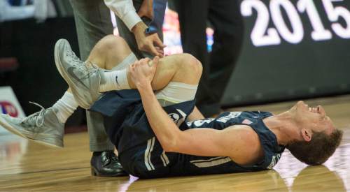 Rick Egan  |  The Salt Lake Tribune

Brigham Young Cougars guard Skyler Halford (23) grimaces in pain, after being injured, in the West Coast Conference championship game, at the Orleans Arena, in Las Vegas, Tuesday, March 10, 2015