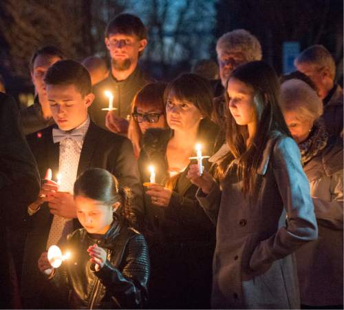 Rick Egan  |  The Salt Lake Tribune

Supporters of John Dehlin hold a candlelight vigil at the North Logan LDS Stake Center as they wait for the decision from Dehlin's disciplinary council in North Logan, Sunday, February 8, 2015