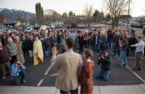 Rick Egan  |  The Salt Lake Tribune

John Dehlin and his wife Margi speak to a crowd of more than 200 people as they arrive at the North Logan LDS Stake Center for the disciplinary council Sunday, February 8, 2015.