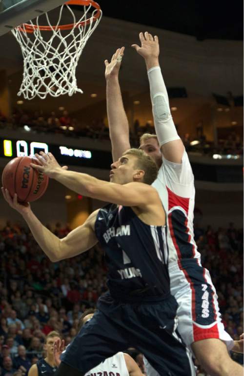 Rick Egan  |  The Salt Lake Tribune

Brigham Young Cougars guard Tyler Haws (3) goes for a loose ball, along with Gonzaga Bulldogs guard Kevin Pangos (4) in the West Coast Conference championship game, BYU vs. Gonzaga, at the Orleans Arena, in Las Vegas, Tuesday, March 10, 2015