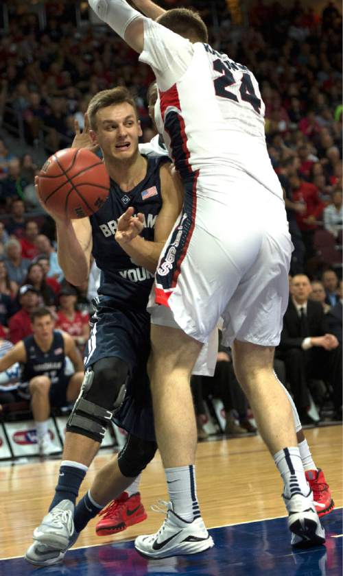 Rick Egan  |  The Salt Lake Tribune

Brigham Young Cougars guard Kyle Collinsworth (5) tries to get past Gonzaga Bulldogs center Przemek Karnowski (24), in the West Coast Conference championship game, BYU vs. Gonzaga, at the Orleans Arena, in Las Vegas, Tuesday, March 10, 2015