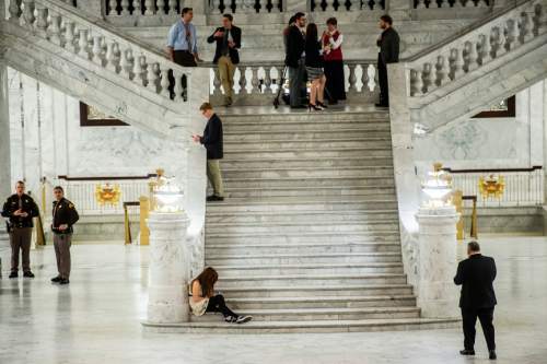 Chris Detrick  |  The Salt Lake Tribune
Citizens and lobbyist wait in the rotunda at Utah State Capitol during the last night of the 2015 legislative session Thursday March 12, 2015.