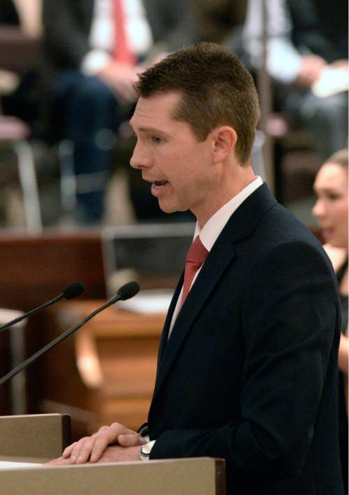 Al Hartmann  |  The Salt Lake Tribune
Incoming Salt Lake County Auditor Scott Tingley speaks to gathered at the Salt Lake County Council chamber Monday January 5 after being administered the oath of office.