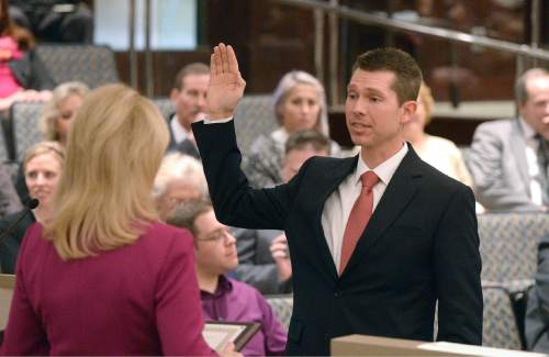 Al Hartmann  |  The Salt Lake Tribune
Oath of office is administered to incoming Salt Lake County Auditor Scott Tingley at the Salt Lake County Council chamber Monday January 5.