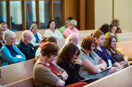 Chris Detrick  |  The Salt Lake Tribune
Attendees pray during the Sunstone Symposium at the Community of Christ Church Saturday March 14, 2015. This "Theology from the Margins Conference" was for Mormons to reflect on their experiences being people of color in the LDS Church.