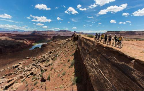 Francisco Kjolseth  |  The Salt Lake Tribune
Mountain bikers pause on  the White Rim trail in Canyonlands in 2013.