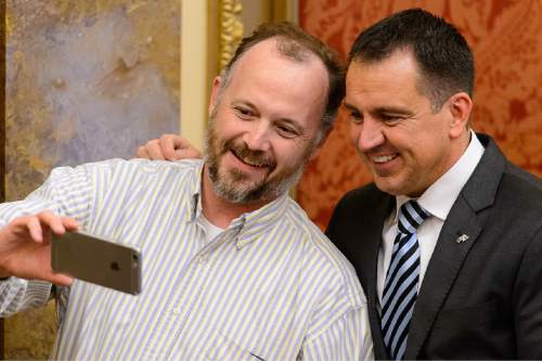 Trent Nelson  |  The Salt Lake Tribune
House Speaker Greg Hughes, right, poses for a selfie in the House Chamber on the last night of the Utah legislative session at the State Capitol Building in Salt Lake City, Thursday March 12, 2015.