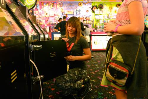 Leah Hogsten  |  The Salt Lake Tribune
 To earn money for college, Shantel Martinez works more than 30 hours a week at Nickelcade, Saturday, March 14, 2015 while handling a full class load as a senior at Granger High School. Martinez and her mother filled out a FAFSA, Free Application for Federal Student Aid last week, and she learned she qualified for nearly $6,000 in aid. Most of Utah's high school seniors skip FAFSA, giving the state the nation's lowest completion rate.
