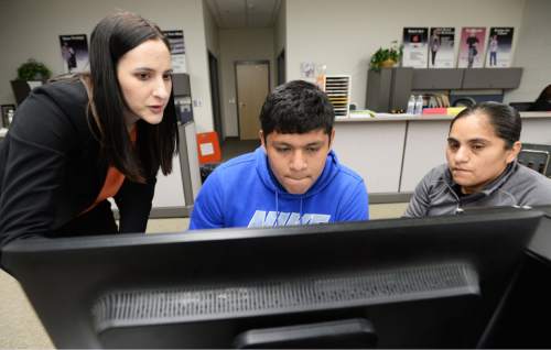 Steve Griffin  |  The Salt Lake Tribune

Maureen Brakke, UHEA outreach officer, left, helps Granger High School senior Carlos Hernandez and his mother Natividad Velasco, fill out his FAFSA form during a FAFSA Open House put on by the Utah System of Higher Education at Granger High School in West Valley City, Wednesday, March 11, 2015.