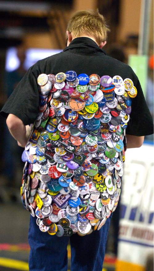 Leah Hogsten  |  The Salt Lake Tribune
Trading pins are a hot item to trade during the annual Utah Regional FIRST Robotics Competition where 53 high school teams from 11 states and Canada compete to see whose robot can stack and sort recyclable materials the fastest, Saturday, March 14, 2015 at the Maverick Center.