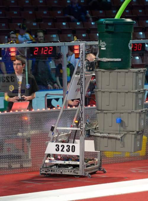 Leah Hogsten  |  The Salt Lake Tribune
Robots score points by stacking totes on scoring platforms, capping those stacks with recycling containers, during the annual Utah Regional FIRST Robotics Competition where 53 high school teams from 11 states and Canada compete to see whose robot can stack and sort recyclable materials the fastest on Saturday at the Maverick Center.
