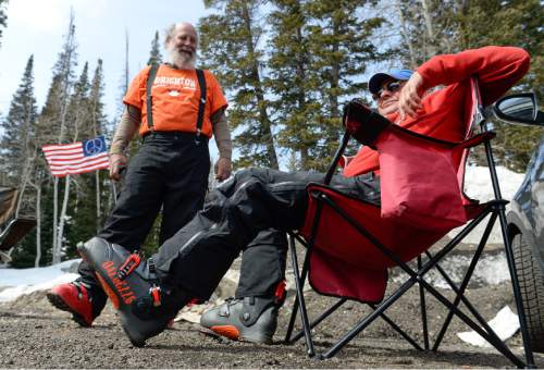 Francisco Kjolseth  |  The Salt Lake Tribune 
Jim Engle, left, and John Eckert take a break from spring skiing conditions at Solitude Mountain Resort while tailgating in the parking lot as part of the FOG group (Friendly Old Guys). Eckert has put in 89 skiing days this year, a bit less than the 130 from last year. "There are bald spots everywhere; it's tragic," he said.