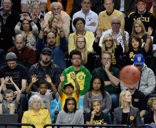Scott Sommerdorf   |  The Salt Lake Tribune
Fans watch Ohio State and VCU in various stages of interest. Ohio State defeated VCU 75-72 in OT at the Moda Center in Portland, Thursday, March 19, 2015.