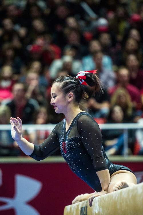 Chris Detrick  |  The Salt Lake Tribune
Utah's Corrie Lothrop competes on the beam during the gymnastics meet against Michigan at the Jon M. Huntsman Center Friday March 6, 2015. Utah defeated Michigan 198.250 to 197.675. Lothrop scored a 9.85.
