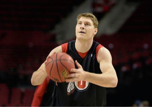 Scott Sommerdorf   |  The Salt Lake Tribune
Utah Utes center Dallin Bachynski, and his missing tooth, practices free throws during the Utes' practice at the Moda Center in Portland, Wednesday, March 18, 2015. The Utes will play Stephen F. Austin Thursday.