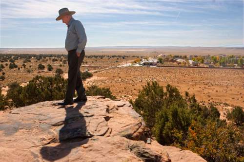 Trent Nelson  |  The Salt Lake Tribune
Former FLDS member and Colorado City Mayor Dan Barlow stands atop Berry Knoll in October 2008, recounting his experiences as a lookout from this very spot in the 1953 polygamy raid on Short Creek. In the background is the community of Centennial Park, whose members have offered to buy property from the UEP land trust including Berry Knoll, a spot with religious significance to the FLDS.