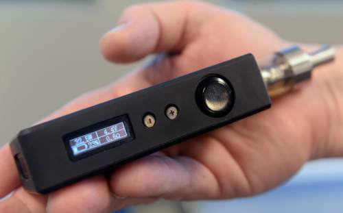 Al Hartmann  |  The Salt Lake Tribune
Third generation e-cigarette has LED screen to display wattage for changing vapor output and rechargeable battery level.  The devices continue to gain in popularity as the state of Utah and local health departments clamp down, trying to keep them away from children and teenagers and ensure the labels show the true content of nicotine.
The governor wants to tax e-cigarettes, and Utah lawmakers are likely to take up legislation again.