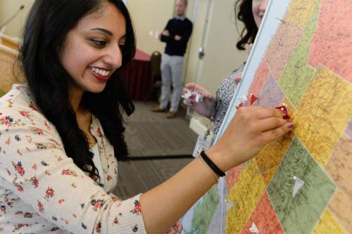 Francisco Kjolseth  |  The Salt Lake Tribune 
Reetu Malhotra places a pin on Salt Lake City, indicating where she will be doing her residency in pediatrics as 74 medical graduate students from the University of Utah participated in Match Day along with fellow graduates across the country.