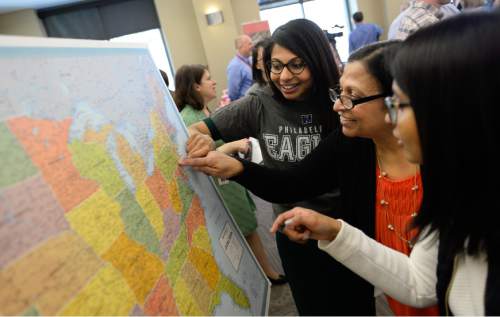 Francisco Kjolseth  |  The Salt Lake Tribune 
University of Utah medical graduate student Swati Narayanam Rao, left, is joined by her mother Gopna and sister Aarati Rao as she points to the spot on the map where she will do her medial residency at Thomas Jefferson University in internal medicine.