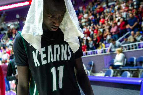 Chris Detrick  |  The Salt Lake Tribune
Kearns's Buay Kuajian (11) walks off of the court after the 4A championship game at the Dee Events Center Saturday February 28, 2015.  Bountiful defeated Kearns 66-54.