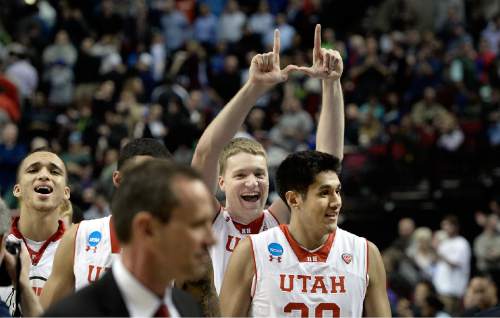 Scott Sommerdorf   |  The Salt Lake Tribune
Utah forward Jeremy Olsen (41) flashes a "U" after the Utes won their first NCAA tournament game in ten years.  Utah defeated Stephen F. Austin 57-50 at the Moda Center in Portland, Thursday, March 19, 2015.