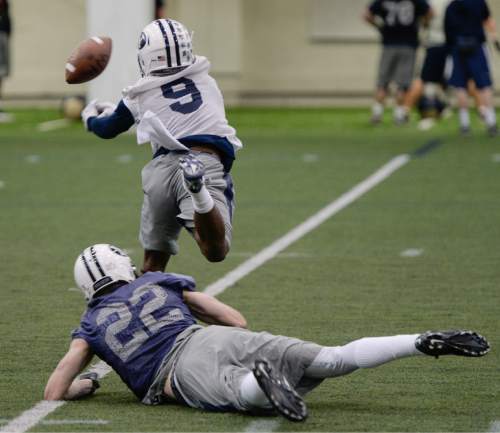 Francisco Kjolseth  |  The Salt Lake Tribune 
BYU football opens spring camp on Monday, March 2, 2015, with indoor practice at the Smith Fieldhouse as defensive back Michael Shelton tries to get ahead of wide receiver Cody Stewart.