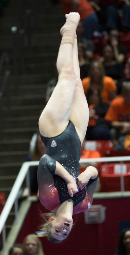 Rick Egan  |  The Salt Lake Tribune

Baely Rowe dismounts from the beam, in the Pac-12 Gymnastics Championships at the Huntsman Center, Saturday, March 21, 2015.