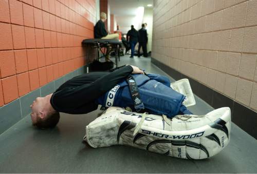 Francisco Kjolseth  |  The Salt Lake Tribune 
Mike Wallingford of Boise State University stretches out before taking to the ice for Division II club hockey on Salt Lake City's Utah Ice Sheet for the ACHA National Championships.