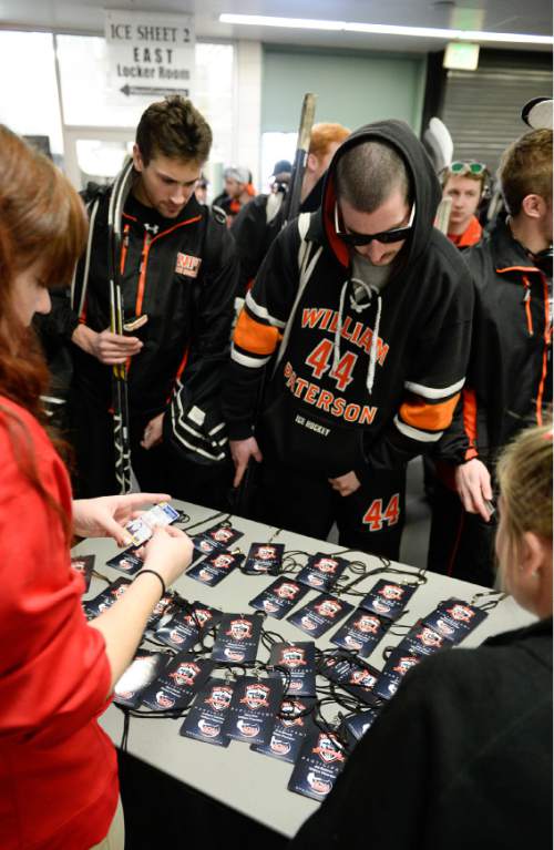 Francisco Kjolseth  |  The Salt Lake Tribune 
William Patterson University players pick up credentials for  the Division II hockey championships at the University of Utah where hundreds of college students from 16 schools compete at the University of Utah's Ice Sheet for the ACHA National Championships.