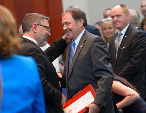 Leah Hogsten  |  The Salt Lake Tribune
l-r Judge Constandinos "Deno" G. Himonas thanks Gov. Gary Herbert before the start of Himonas' investiture ceremony. Himonas was sworn in as a justice to the Utah Supreme Court, Wednesday, March 18, 2015, at the Scott M. Matheson Courthouse.