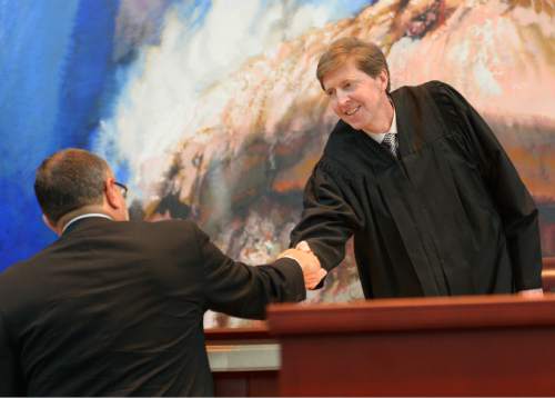 Leah Hogsten  |  The Salt Lake Tribune
Former 3rd District Court Judge Constandinos "Deno" G. Himonas, left, shakes the hand of Utah Supreme Court Chief Justice Matthew Durrant after Himonas' swearing in as a justice to the Utah Supreme Court Wednesday at the Scott M. Matheson Courthouse.