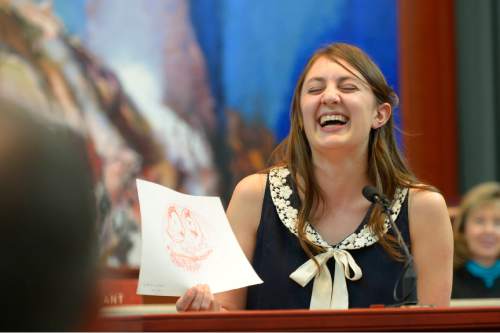 Leah Hogsten  |  The Salt Lake Tribune
Katherine Himonas, daughter of Judge Constandinos "Deno" G. Himonas, laughs as she shows the drawing she made of her father when she was a child. Himonas was sworn in as a justice to the Utah Supreme Court, Wednesday, March 18, 2015, at the Scott M. Matheson Courthouse.