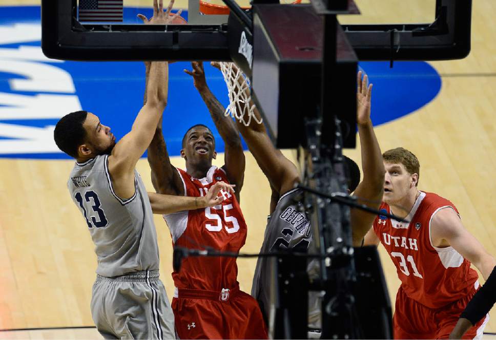 Scott Sommerdorf   |  The Salt Lake Tribune
Utah Utes guard Delon Wright (55) and Utah Utes center Dallin Bachynski (31) wait to see if Wright's shot will fall as Georgetown Hoyas forward Paul White (13) tries to defend  during first half play. Utah defeated Georgetown 75-64 to advance to the "Sweet Sixteen", Saturday, March 21, 2015.