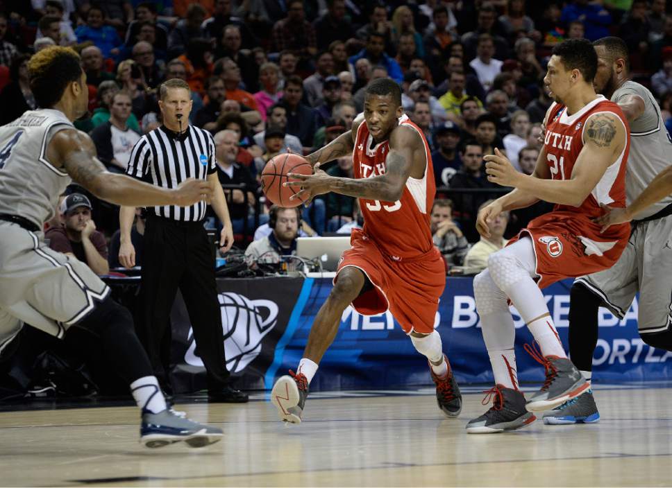 Scott Sommerdorf   |  The Salt Lake Tribune
Utah Utes guard Delon Wright (55) darts through an opening in the Georgetown defense during second half play. Utah defeated Georgetown 75-64 to advance to the "Sweet Sixteen", Saturday, March 21, 2015.