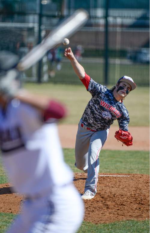 Francisco Kjolseth  |  The Salt Lake Tribune 
Woods Cross pitcher Brady Chilos works at trying to strike out Alex Baeza of Jordan High in game action on Thursday, March 19, 2015, in Sandy.