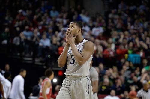 Scott Sommerdorf   |  The Salt Lake Tribune
Georgetown Hoyas forward Mikael Hopkins (3) starts to realize the Hoyas will not have time to catch up late in the game. Utah defeated Georgetown 75-64 to advance to the "Sweet Sixteen", Saturday, March 21, 2015.