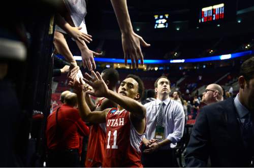 Scott Sommerdorf   |  The Salt Lake Tribune
Utah Utes guard Brandon Taylor (11) gets congratulations from fans as he leaves the court after Utah defeated Georgetown 75-64 to advance to the "Sweet Sixteen", Saturday, March 21, 2015.