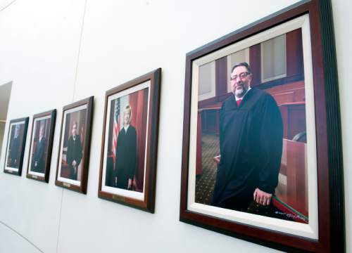 Steve Griffin  |  The Salt Lake Tribune

A portrait of Deno Himonas, the new justice on the Utah Supreme Court, right, joins the other justices outside the Utah Supreme Court in the Matheson Courthouse in Salt Lake City, Thursday, March 19, 2015. Portraits of former justices hang on the wall.