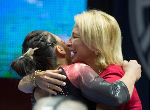 Rick Egan  |  The Salt Lake Tribune

Corrie Lothrop gets a hug from Megan Marsden after competing on the Beam for Utah, in the Pac-12 Gymnastics Championships at the Huntsman Center, Saturday, March 21, 2015.