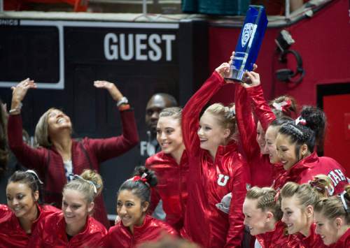 Rick Egan  |  The Salt Lake Tribune

The Lady Utes hold up the first place trophy  as they celebrate their first place finish in the Pac-12 Gymnastics Championships at the Huntsman Center, Saturday, March 21, 2015.