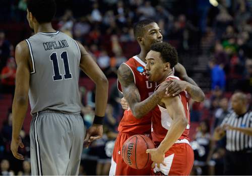 Scott Sommerdorf   |  The Salt Lake Tribune
Utah Utes guard Delon Wright (55) hugs team mate Brandon Taylor (11) after the final horn sounded and Utah defeated Georgetown 75-64 to advance to the "Sweet Sixteen", Saturday, March 21, 2015.