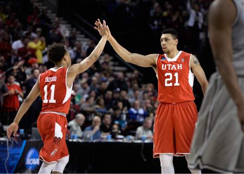 Scott Sommerdorf   |  The Salt Lake Tribune
Utah Utes guard Brandon Taylor (11) and Utah Utes forward Jordan Loveridge (21) slap hands after a successful offense play during second half play. Utah defeated Georgetown 75-64 to advance to the "Sweet Sixteen", Saturday, March 21, 2015.