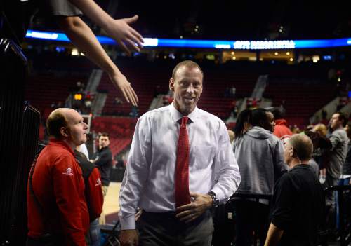 Scott Sommerdorf   |  The Salt Lake Tribune
Utah Utes head coach Larry Krystkowiak leaves the court after Utah defeated Georgetown 75-64 to advance to the "Sweet Sixteen", Saturday, March 21, 2015.
