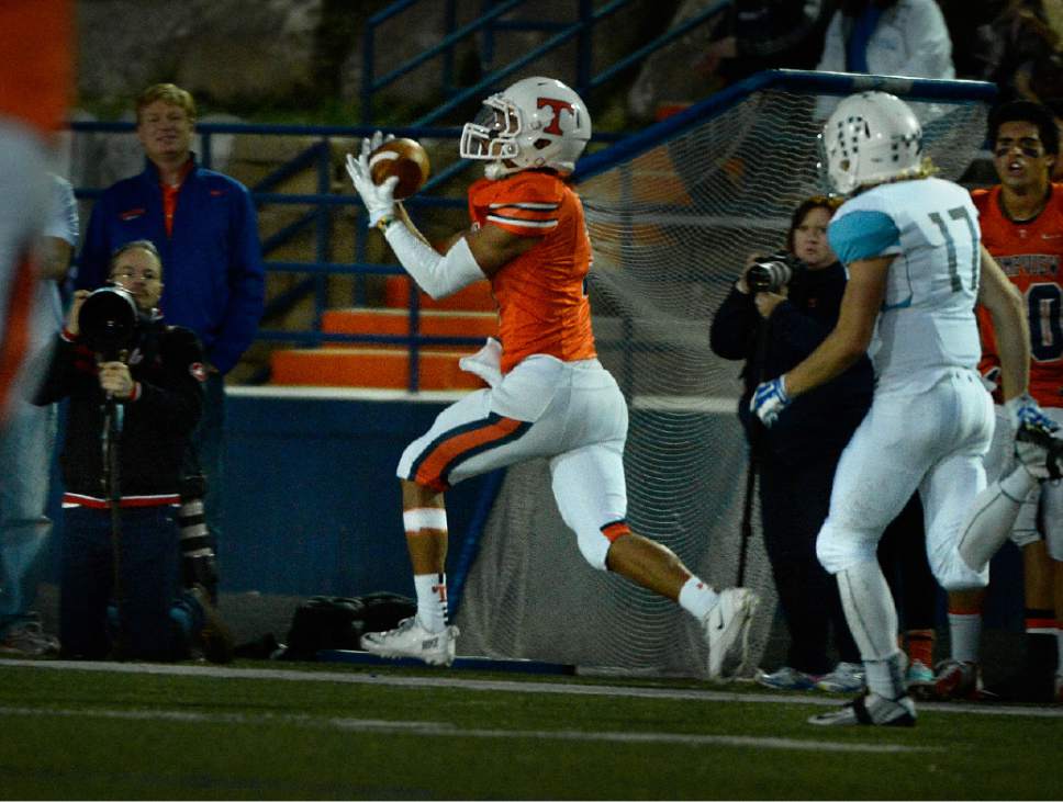 Scott Sommerdorf  |  The Salt Lake Tribune
Timpview WR Jordan Espinoza grabs this 63 yd TD pass from QB Britain Covey to give TV a 28-0 lead. Timpview beat Sky View of Smithfield, 45-8 in a 4A state quarterfinal playoff game Friday, November 7, 2014 in Provo.