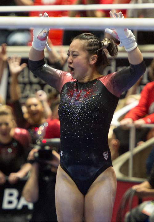 Rick Egan  |  The Salt Lake Tribune

Corrie Lothrop reacts as she lands her dismount from the bars for the Utes, in the Pac-12 Gymnastics Championships at the Huntsman Center, Saturday, March 21, 2015.